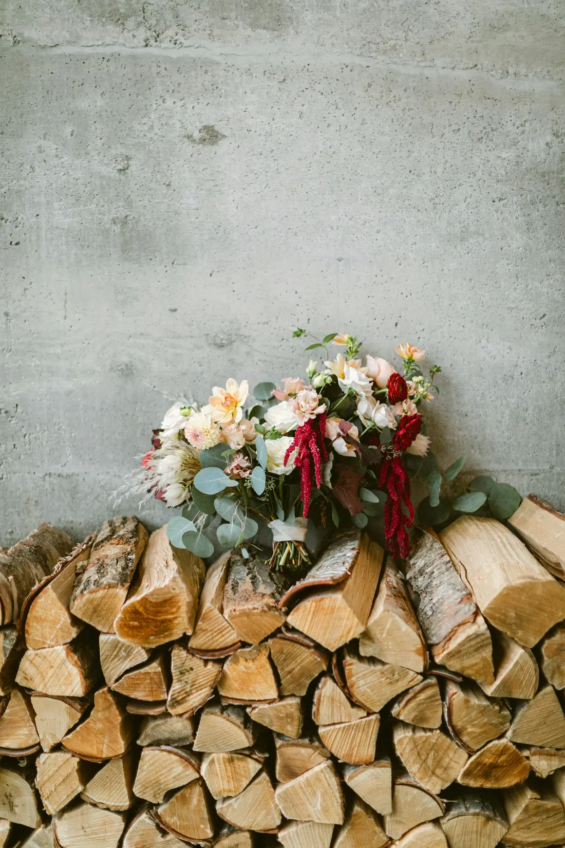 A bouquet resting on Ray's stack of split oak