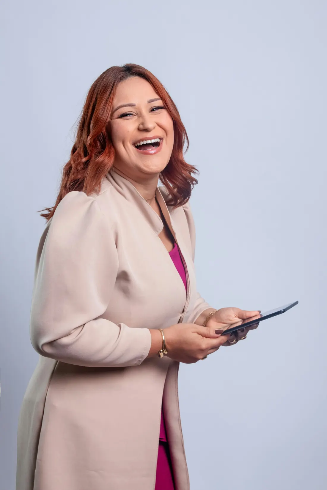 Dr. Lena Marsh laughing, holding a tablet