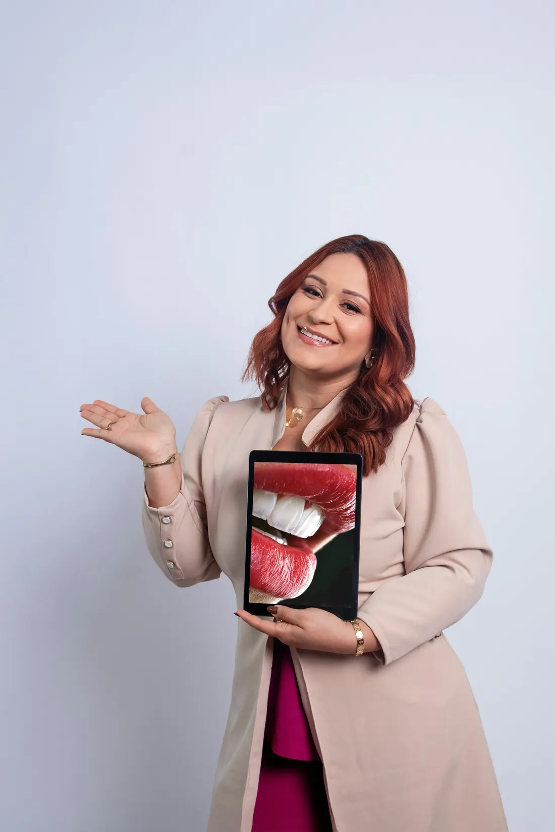 Dr. Lena Marsh holding a tablet that shows a close-up smile